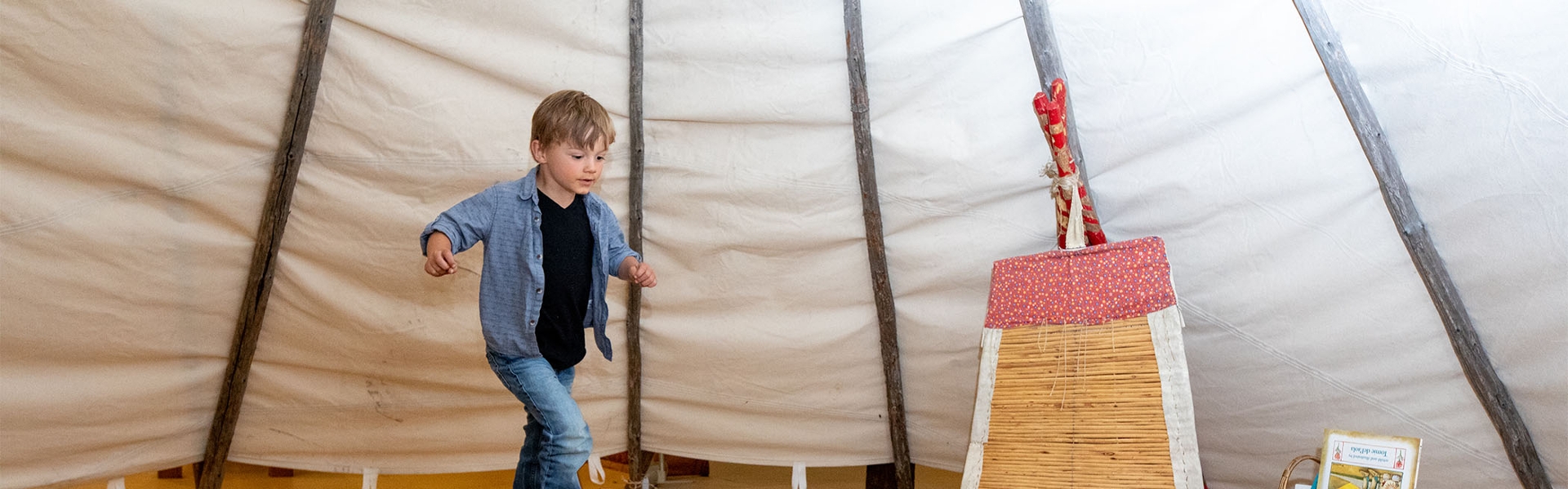 Child in a tipi