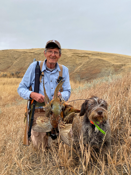 Man hunting with his dog