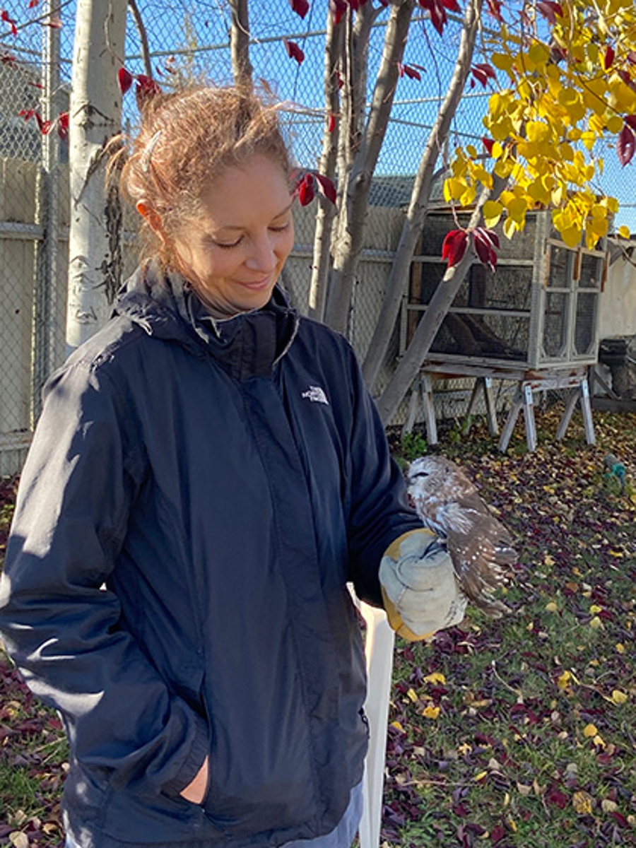 Anna Schmidt holding a raptor