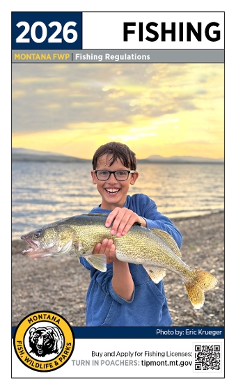 Cover of the 2026 Fishing Regulations - young boy with a walleye