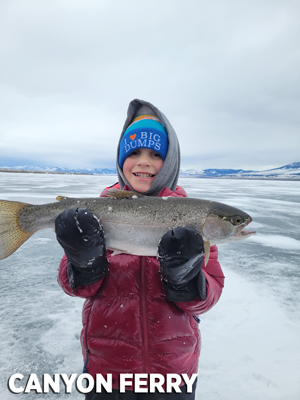 kid holding rainbow trout