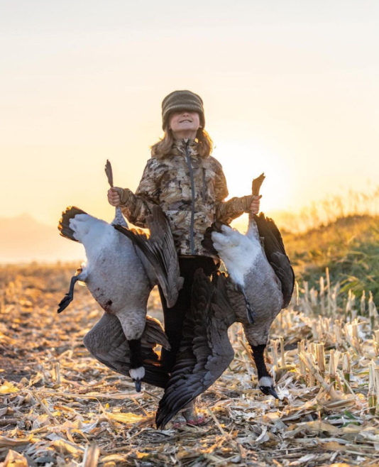 Youth with goose harvests