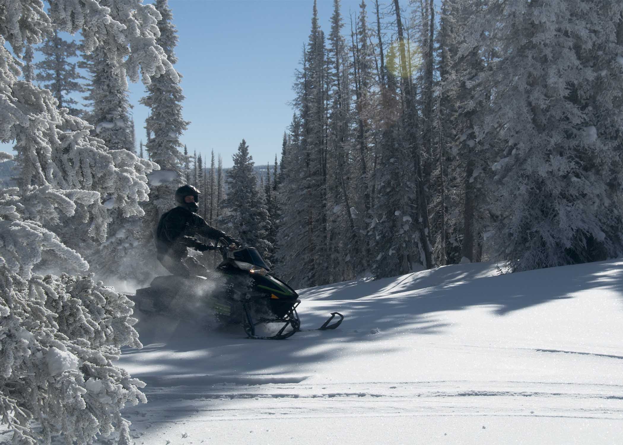 Snowmobile on groomed trail