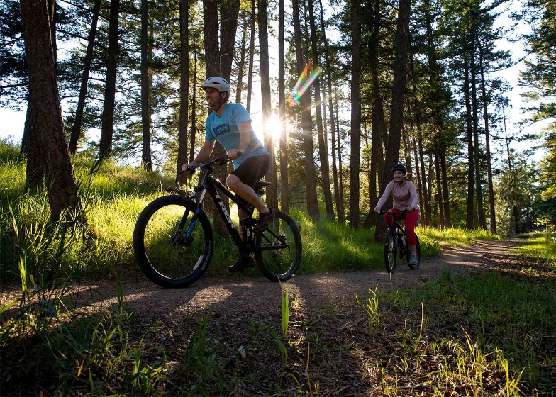 Two people biking