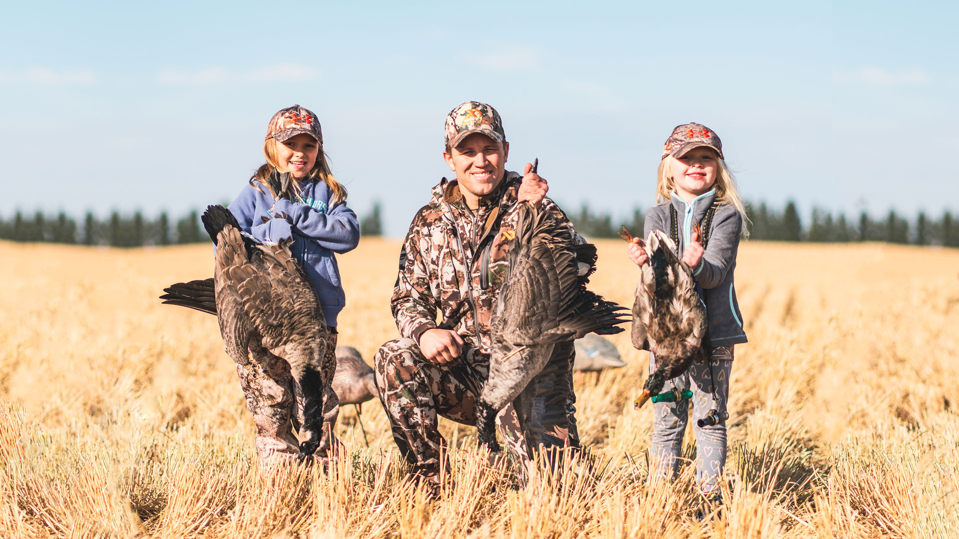 Father and daughters waterfowl hunting