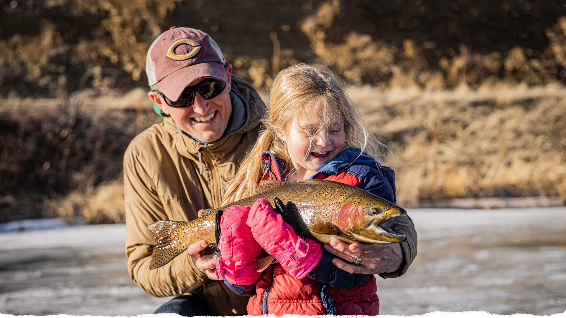 Father and daughter ice fishing