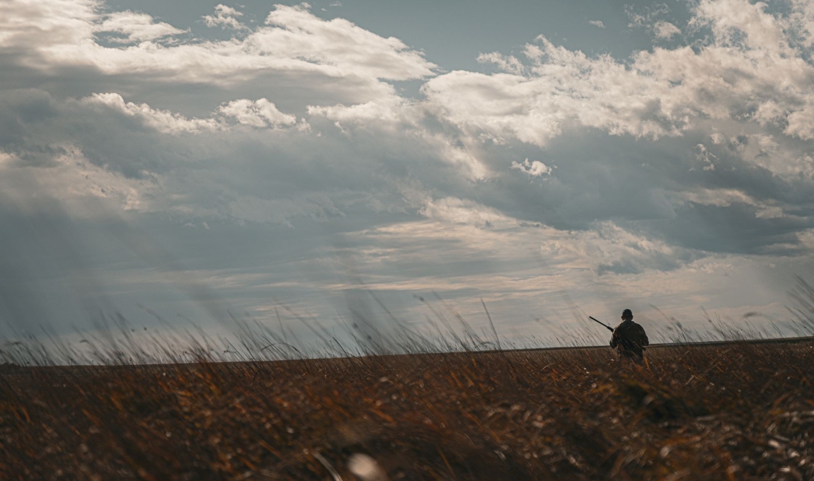 Photo of hunter on landscape