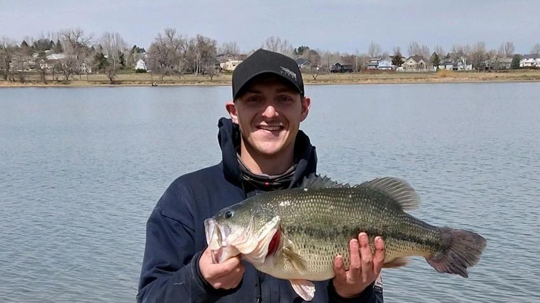 Brandon Wright displays his record largemouth bass after pulling it from the water at Lake Elmo in Billings Heights Saturday.