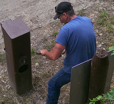 Individual breaking into self-pay station