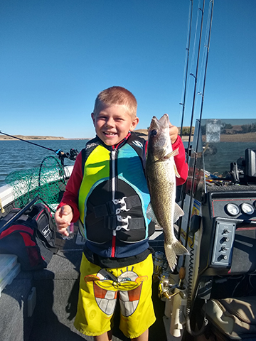 A young angler with a nice walleye. - photo by Cody Nagel