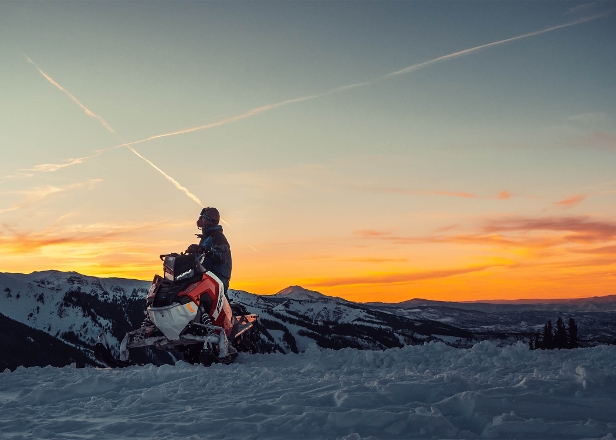 Person with snowmobile