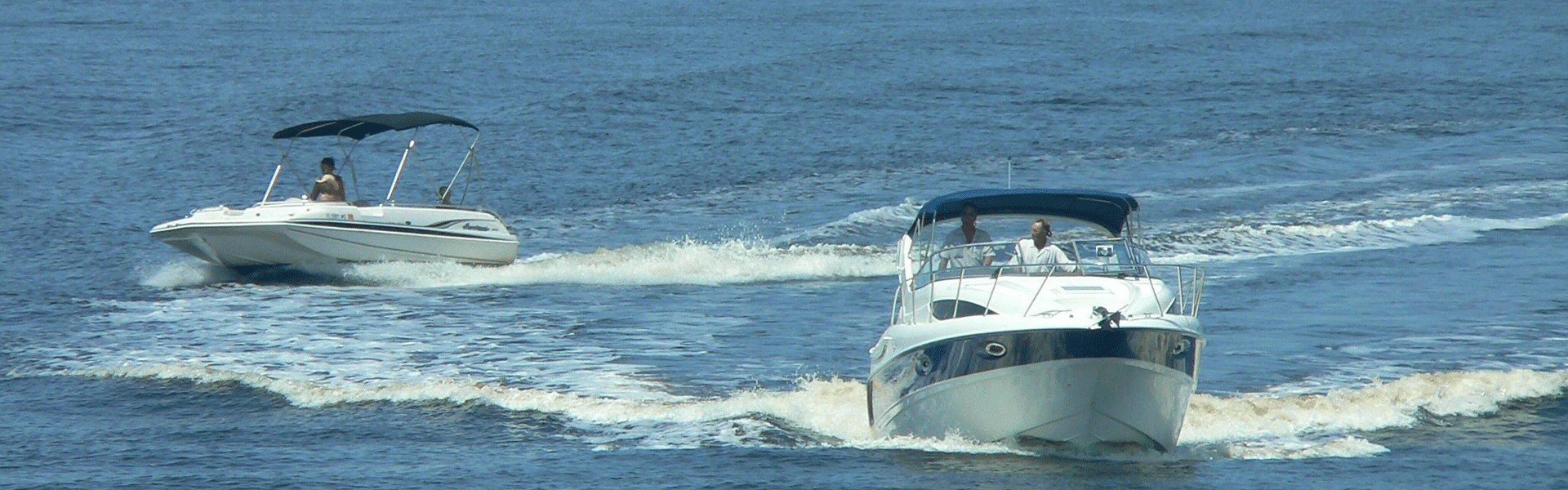 two boats close to each other on a lake