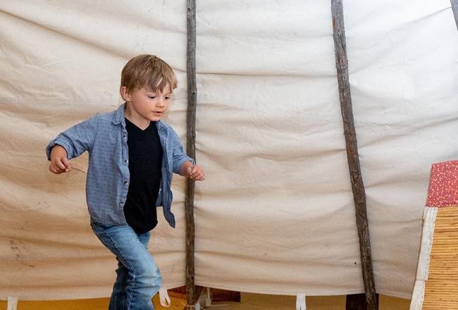 Boy in teepee