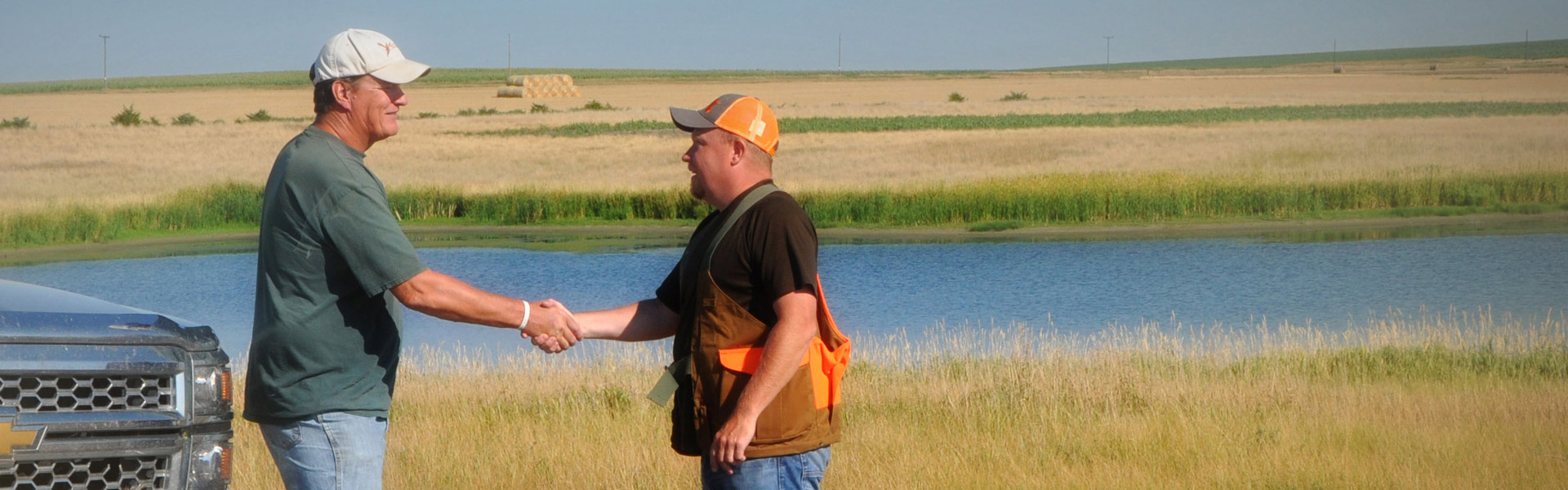 Landowner and hunter shaking hands