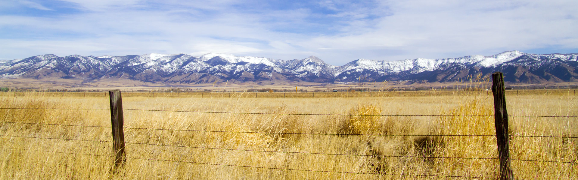 Fence against winter Montana landscape