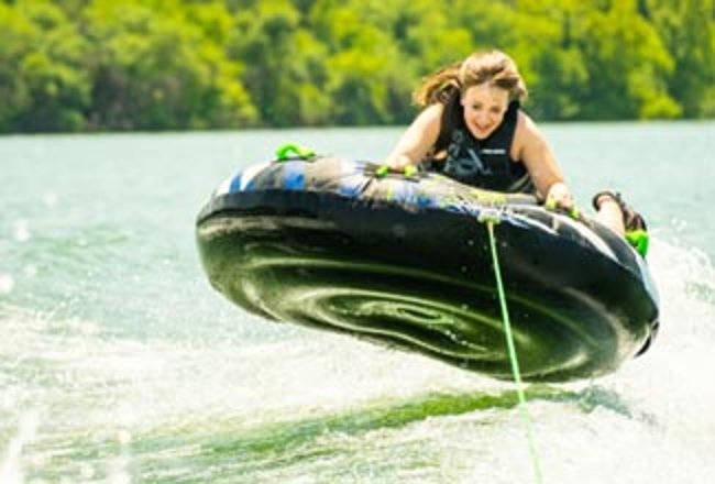 Tuber behind boat